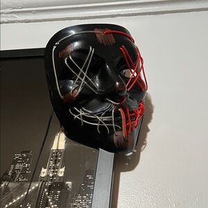 Black Mask with Red and Silver Accents